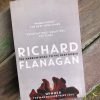 Grey front over of the narrow road to the deep north by richard flanagan