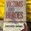 picture of the novel victims and heroes by konstantin simonov leaning on a yellow cushion